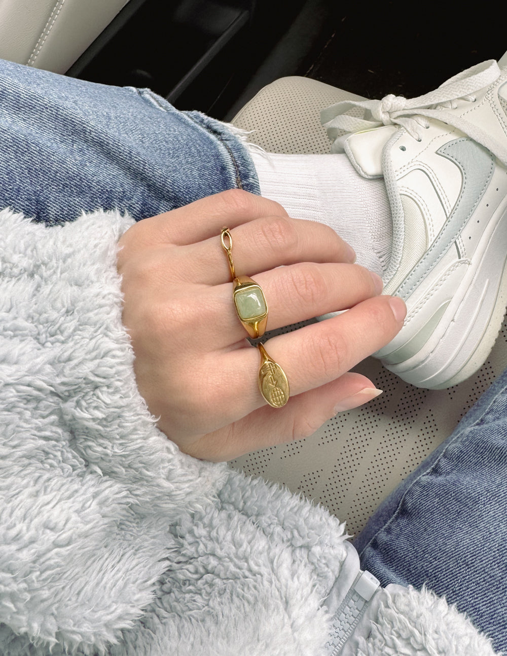 Disciple ring, gold-tone oval engraved signet ring on finger