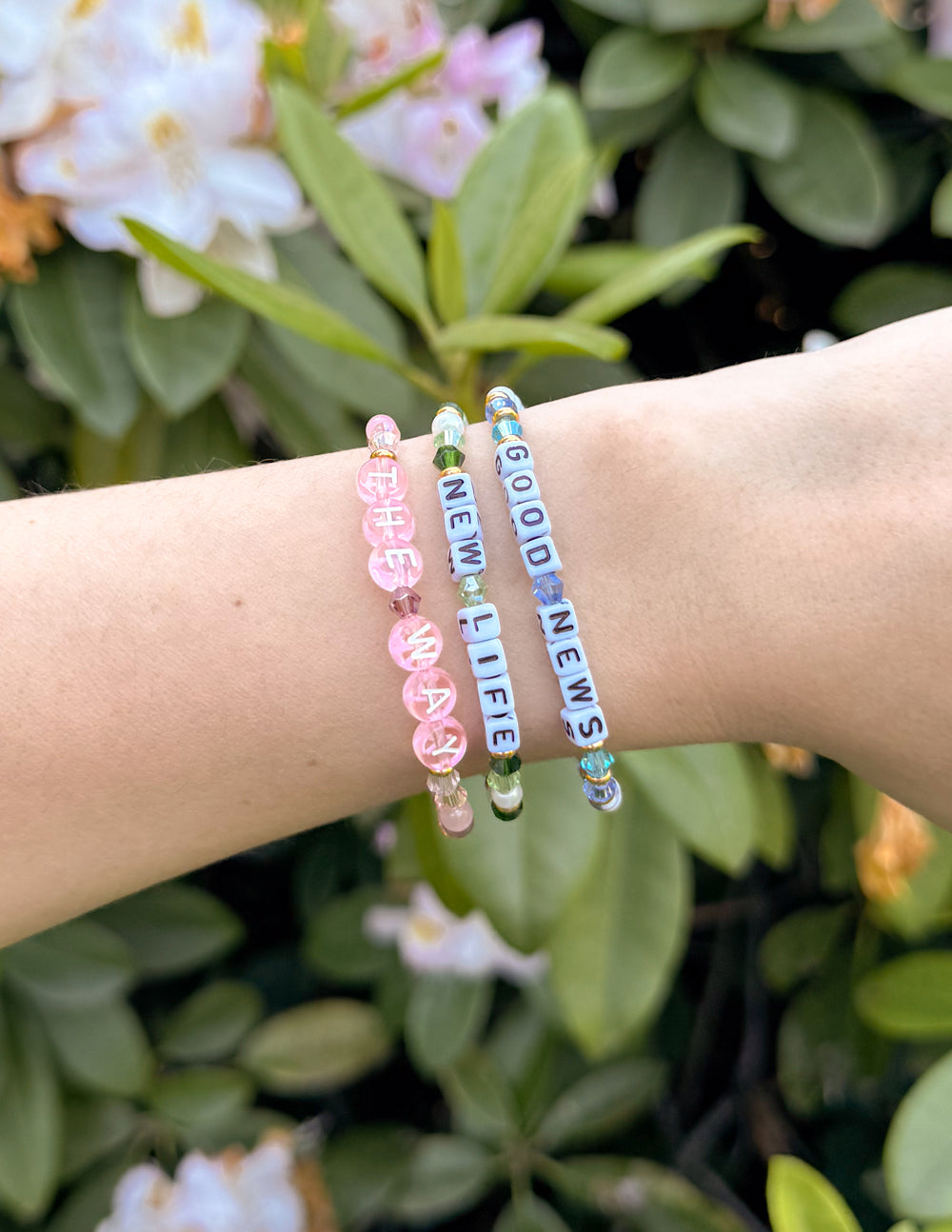 Pink and blue beaded 'NEW LIFE' bracelet with gold heart charm and letter beads