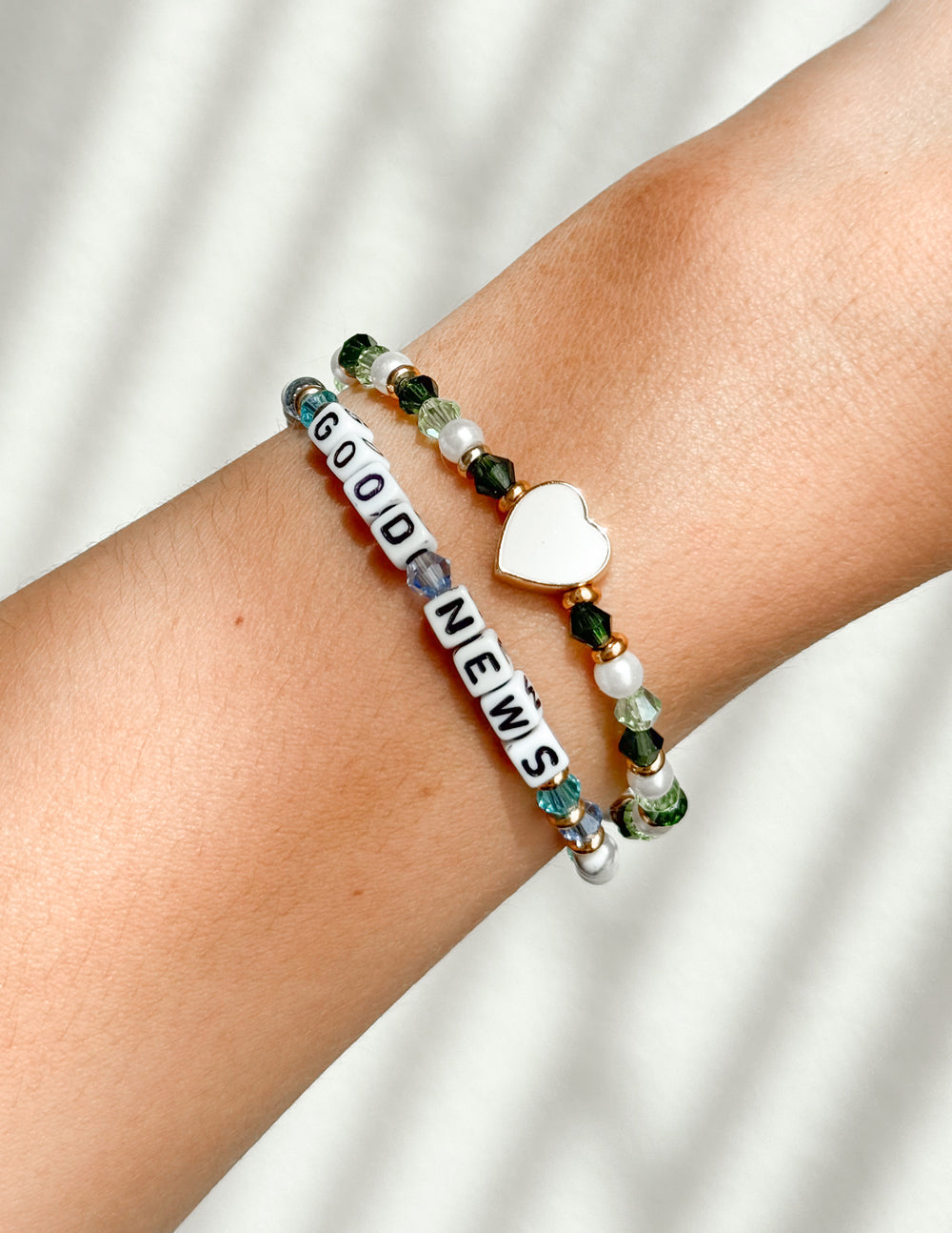 Green and white beaded 'NEW LIFE' bracelet with gold heart charm and bead accents