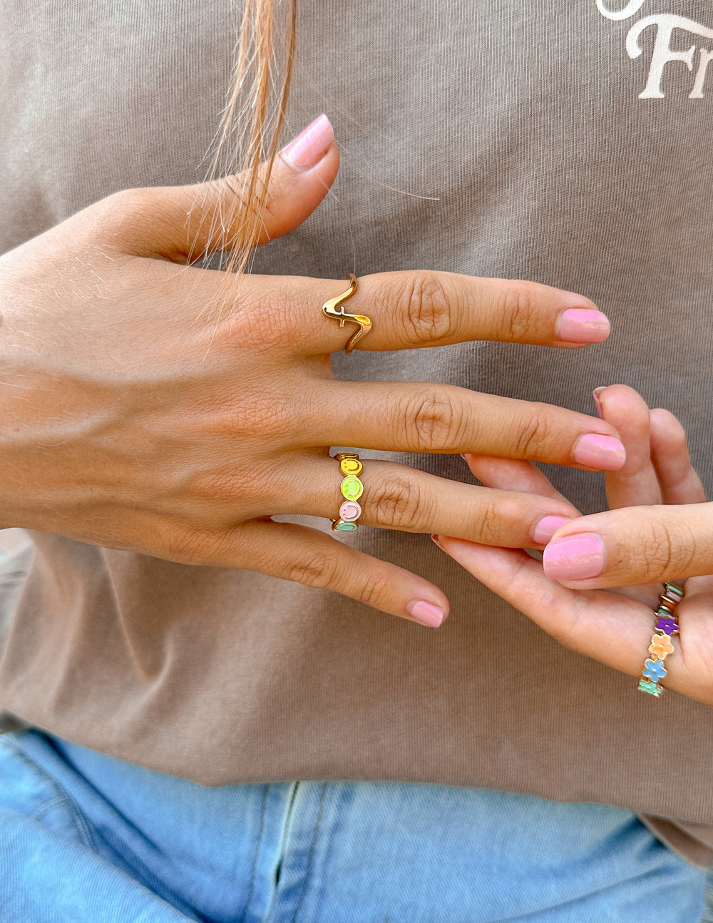 Gold smiley enamel ring with pastel yellow and pink disc details