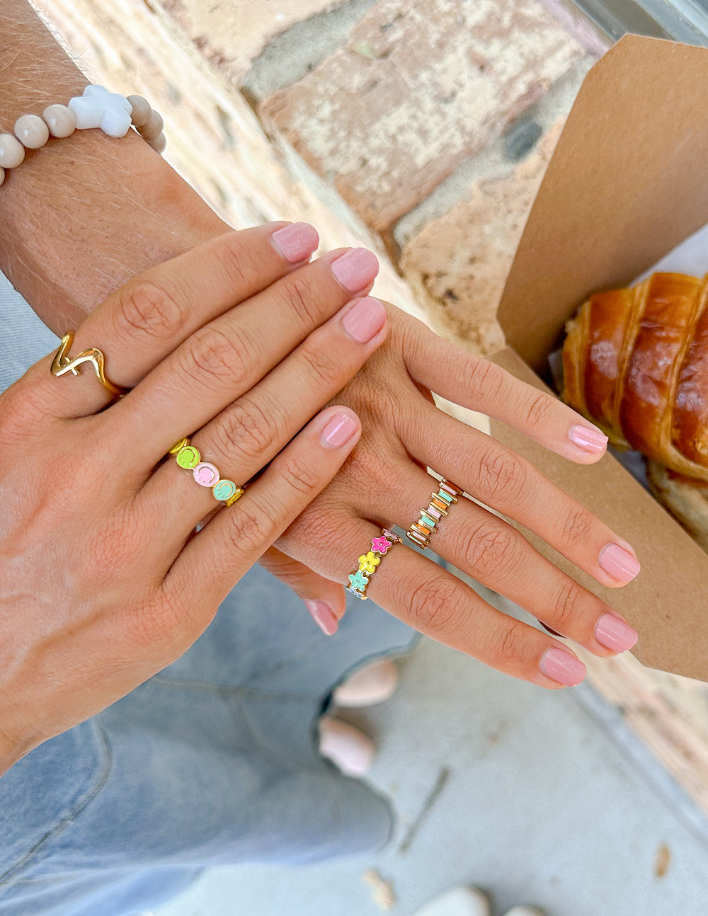 Gold-tone enamel flower band ring with multicolor floral links and flower charms