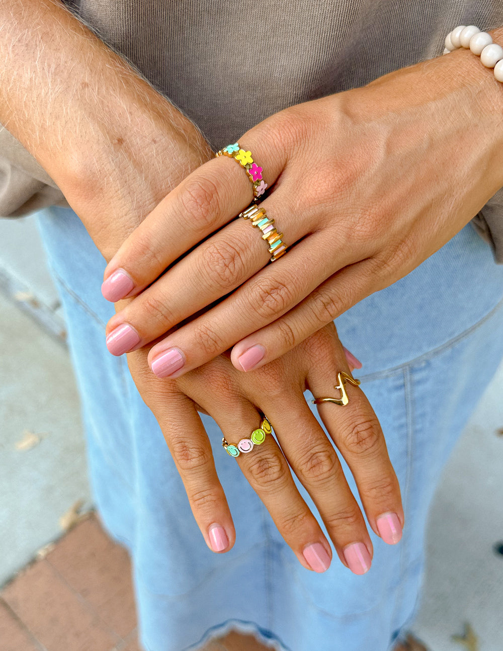 Gold smiley enamel ring with yellow face and bright pink and green enamel accents