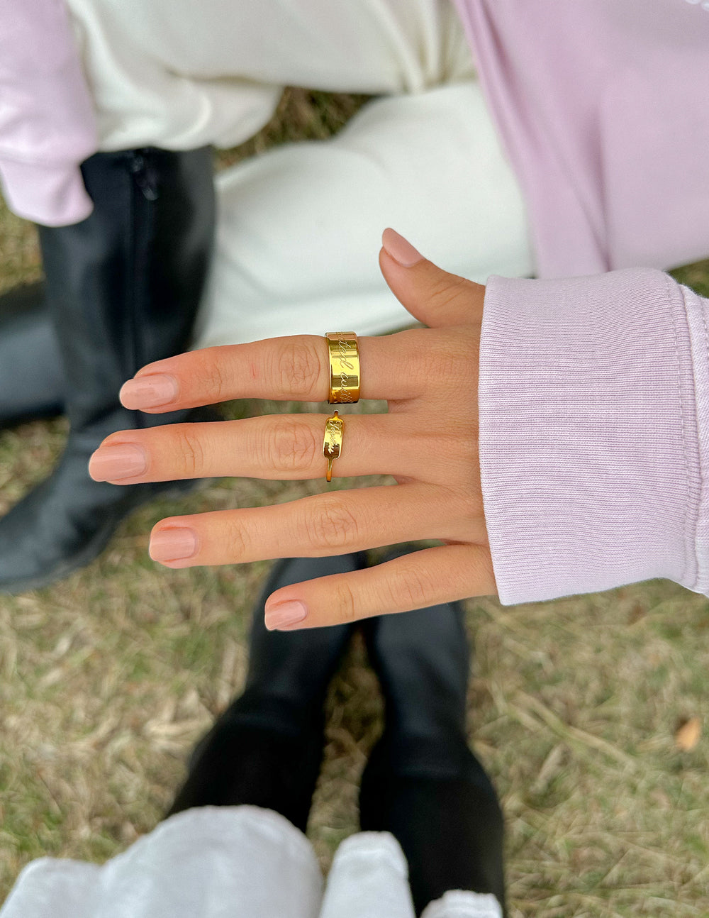 Gold Fearless signet ring with slim band stacked on fingers