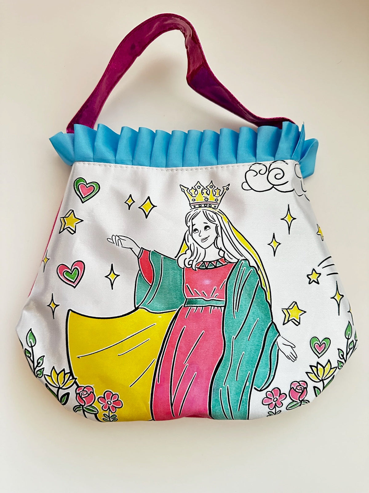 Color and pray purse featuring Mary with crown, blue ruffled top and multicolor details