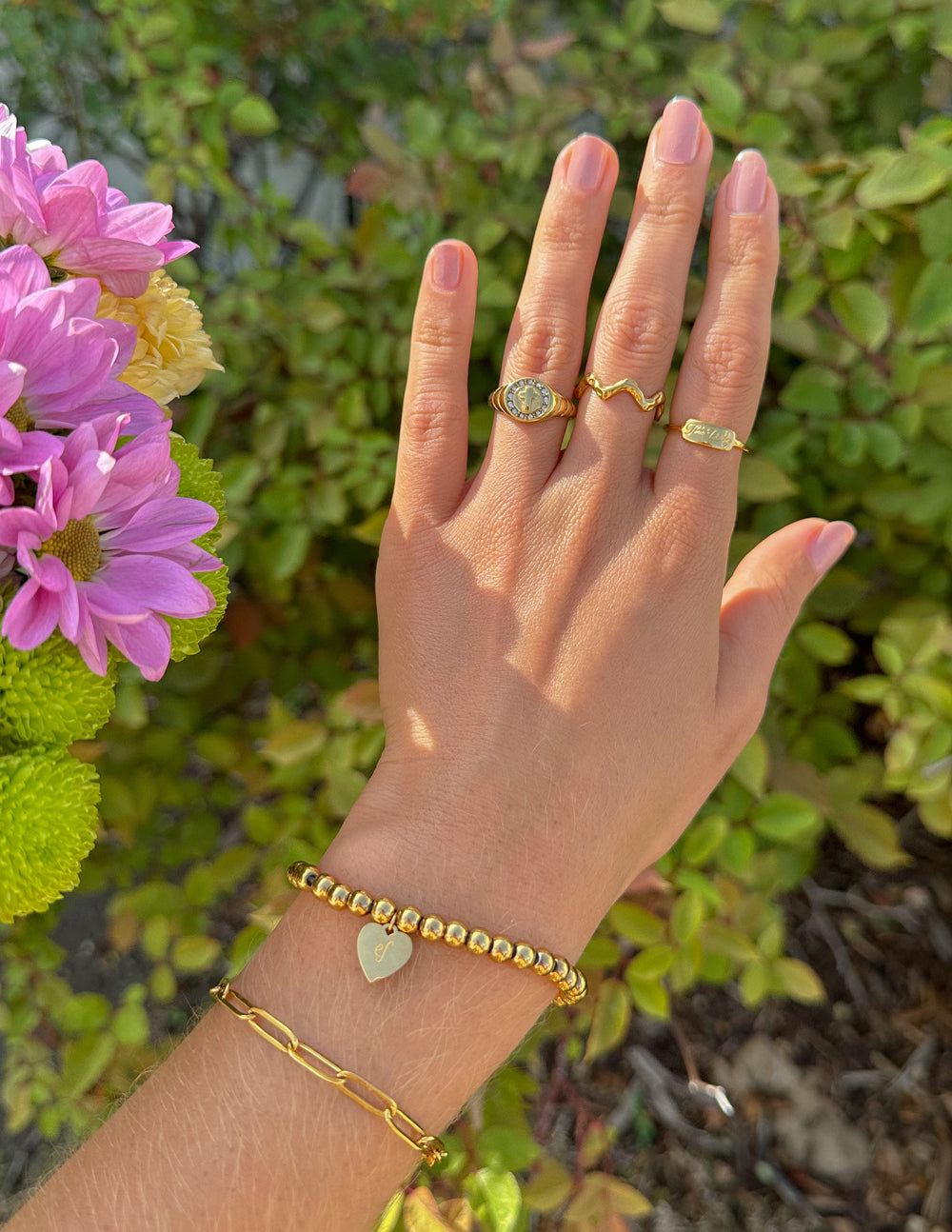Gold-tone textured wavy band ring on finger, zigzag wave texture