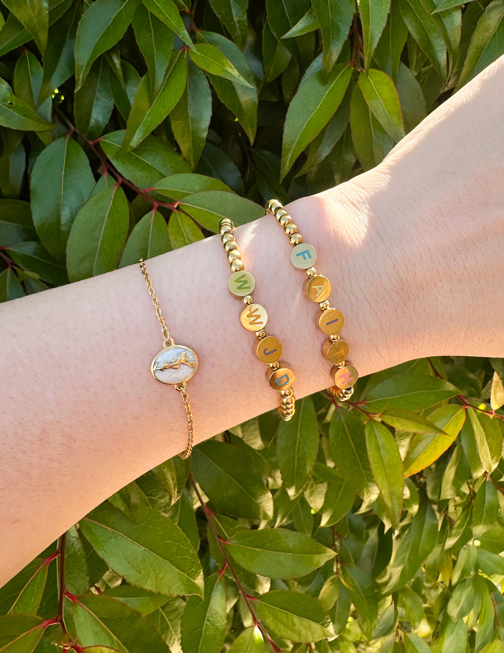 Gold beaded letter bracelet with round beads and colorful letter charms