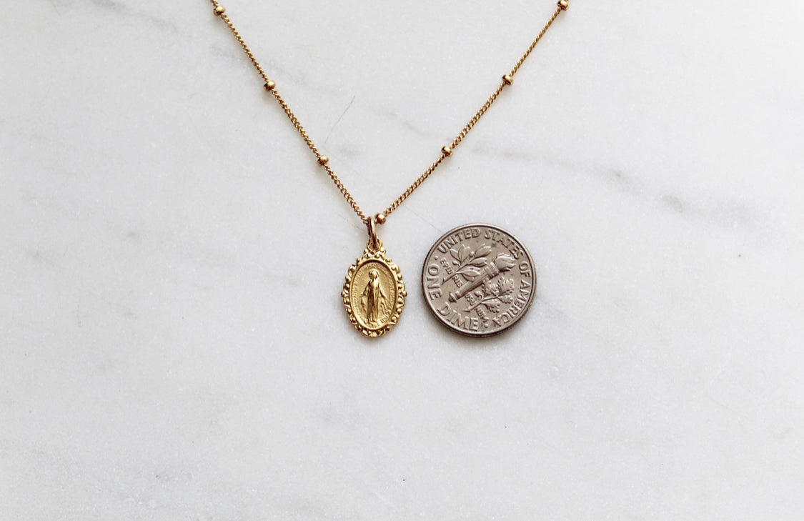 Gold-tone chain necklace with oval Miraculous medal and coin-like pendant