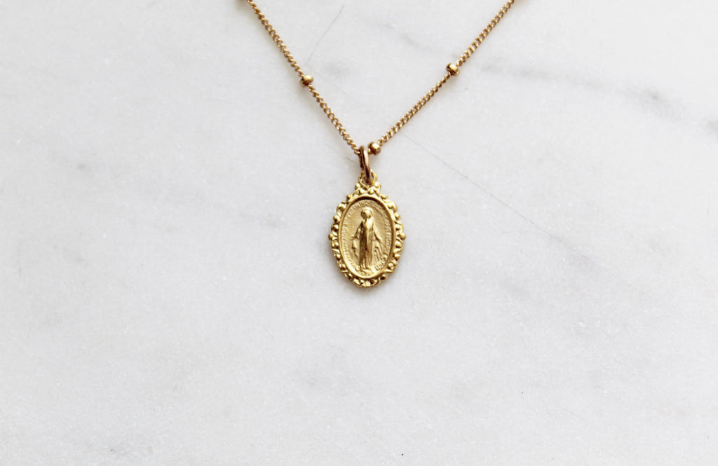Gold-tone chain necklace with single oval Miraculous medal pendant