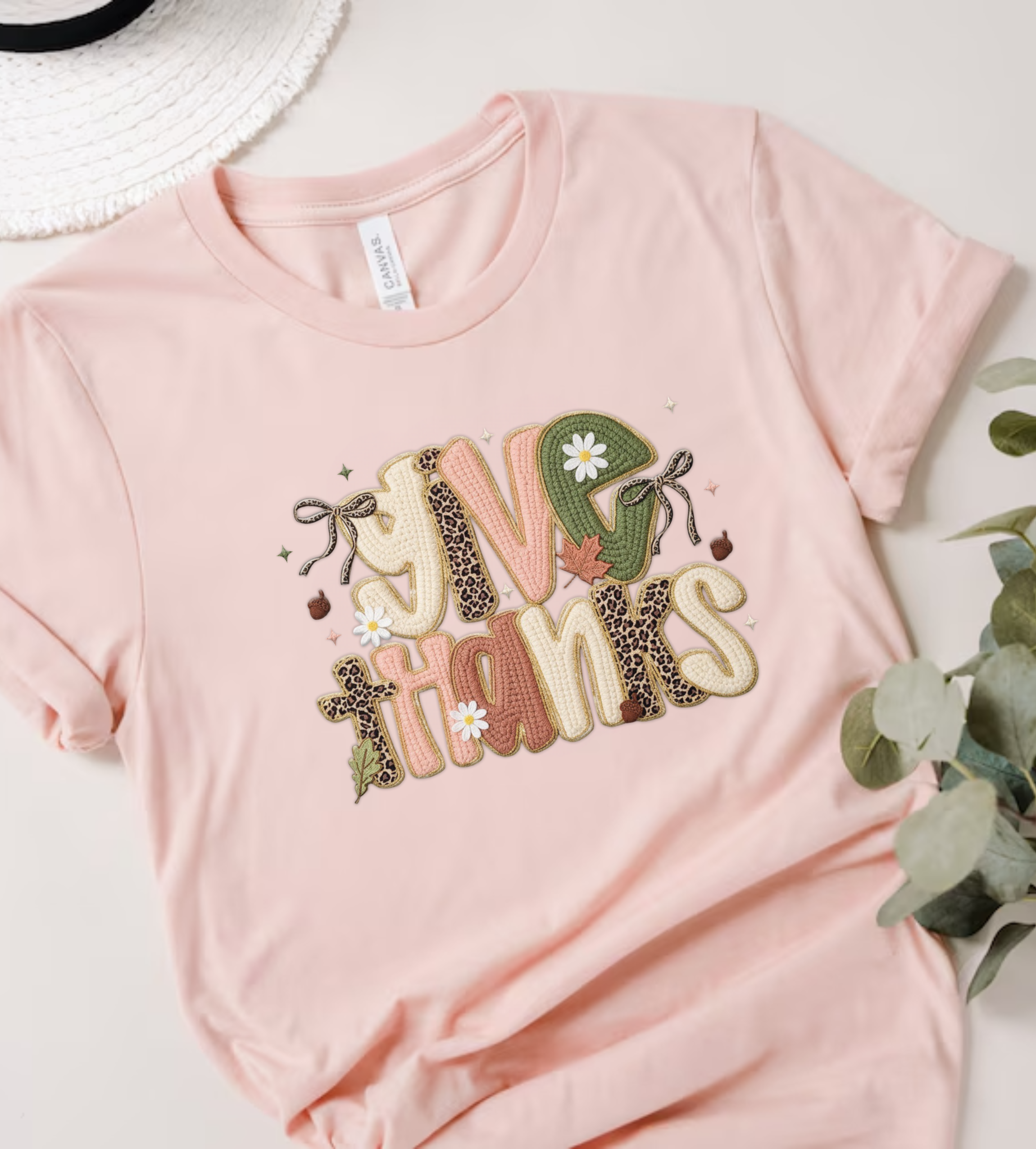 Blush pink crewneck T-shirt with 'Give Thanks' patch-style graphic