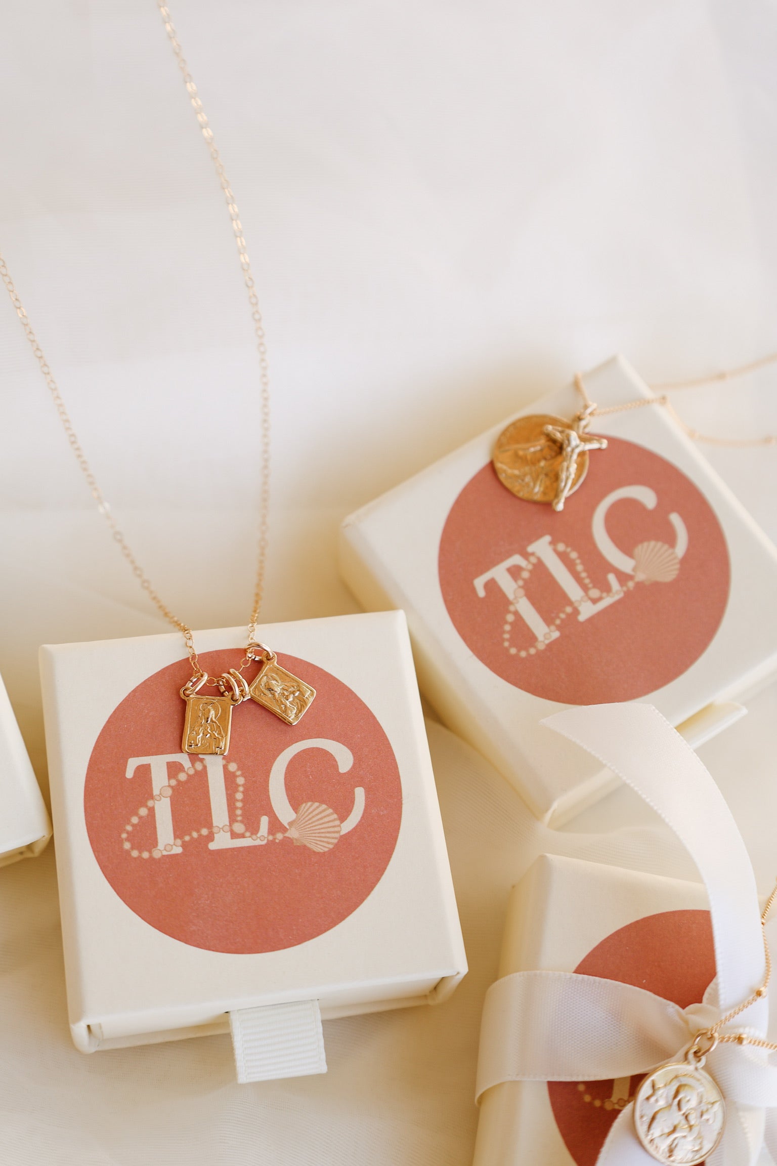 St. Therese of Lisieux crucifix necklace with gold-tone charm in white gift boxes