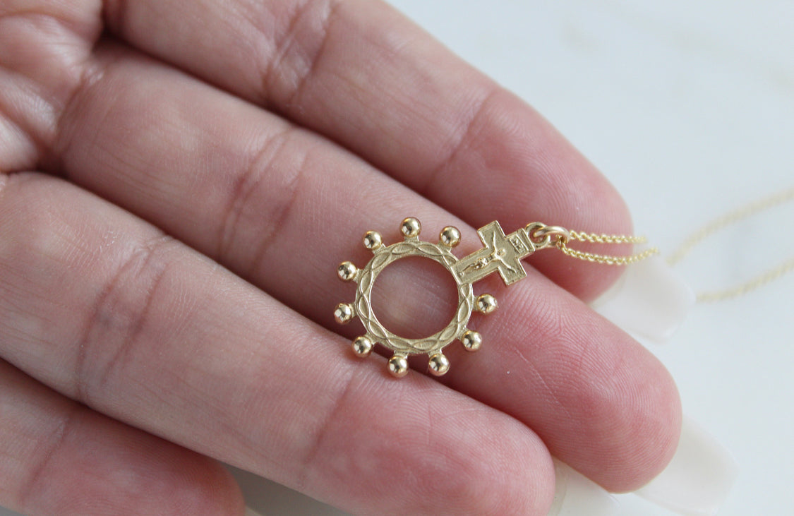 14k gold rosary bead pendant: round ring with bead rays and cross