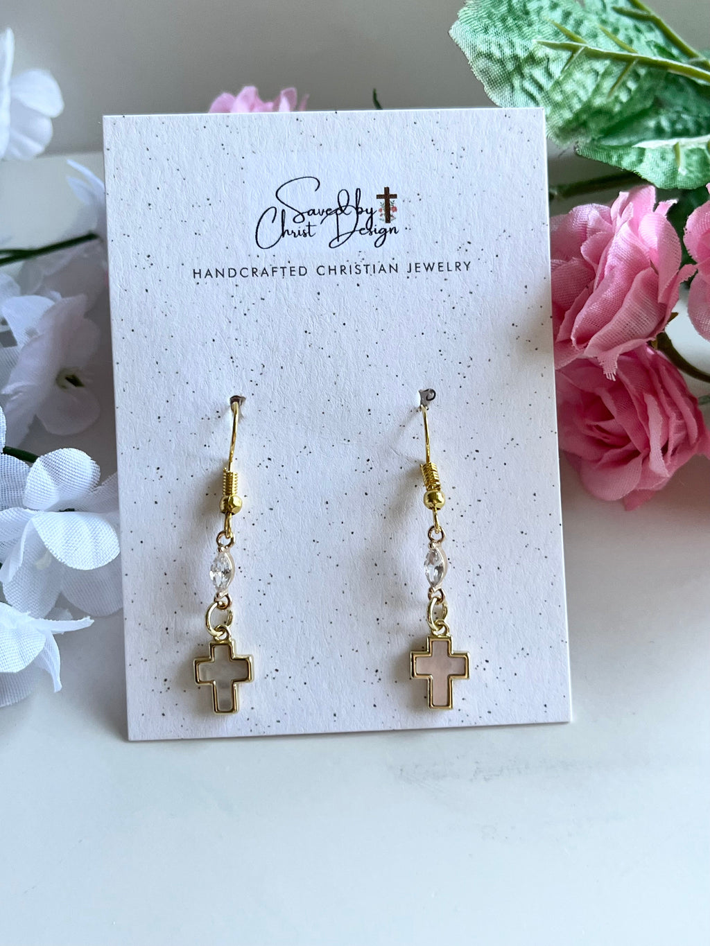 Gold-tone cross drop earrings on card, pair with cruciform cross charms.