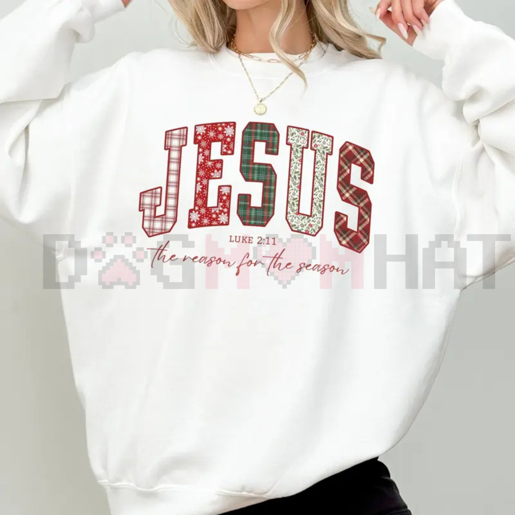 White crewneck sweatshirt with red “JESUS” holiday graphic