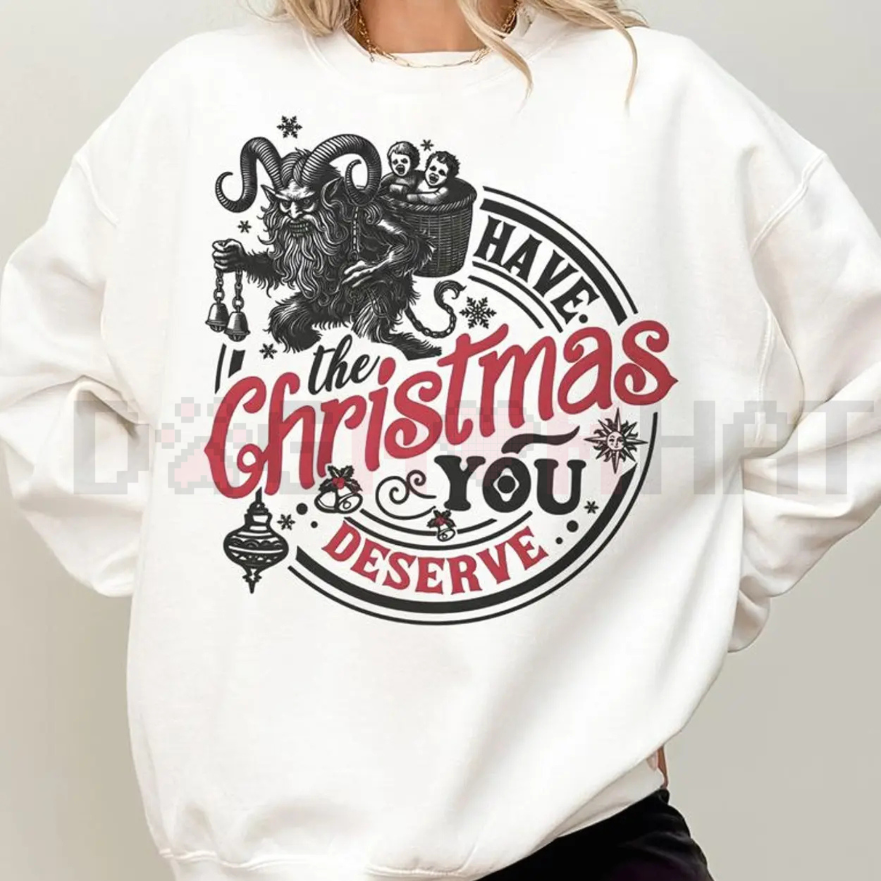 White sweatshirt with gothic back graphic: “Have the Christmas you deserve”.