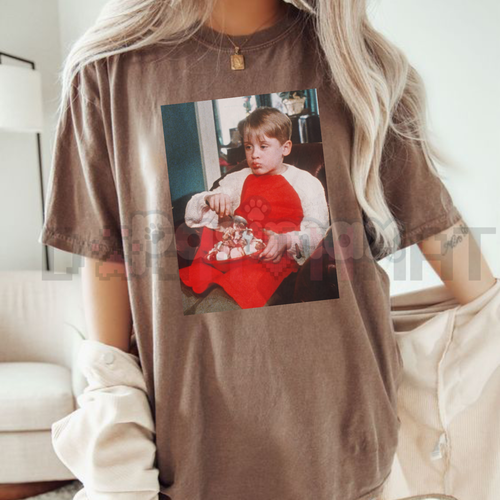 Brown Christmas t-shirt with front photo graphic of a boy holding toys
