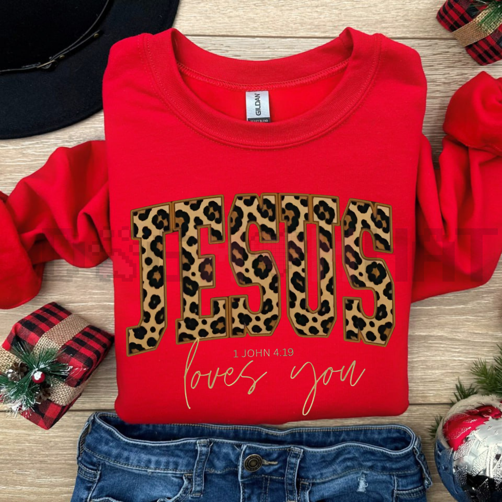Red crewneck sweatshirt with leopard JESUS print and gold love you script.