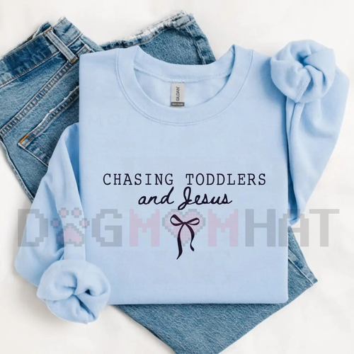 Light blue sweatshirt with puff sleeves and 'Chasing Toddlers and Jesus' graphic