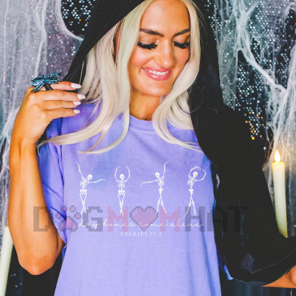Purple T-shirt with white dancing skeletons graphic and heart-shaped pixel design