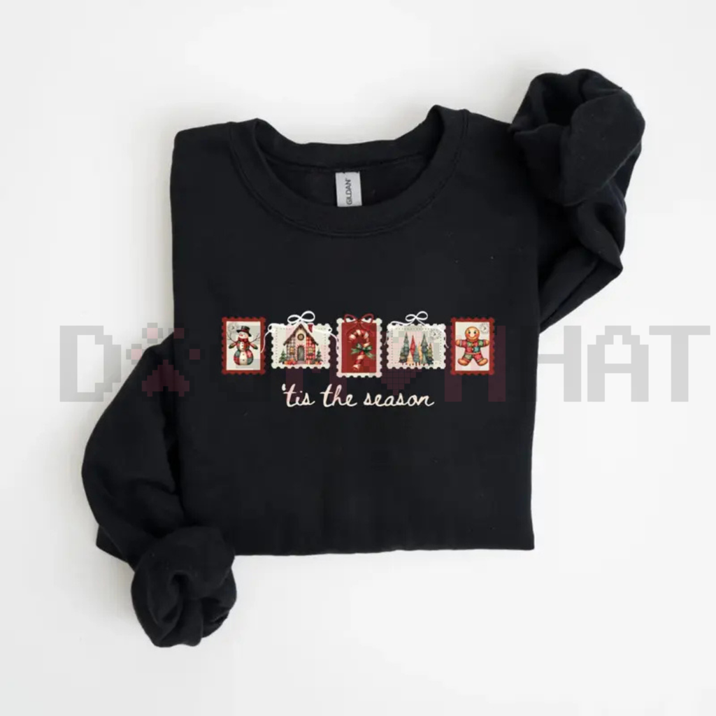 Black sweatshirt with long sleeves and festive stamp graphic across the chest