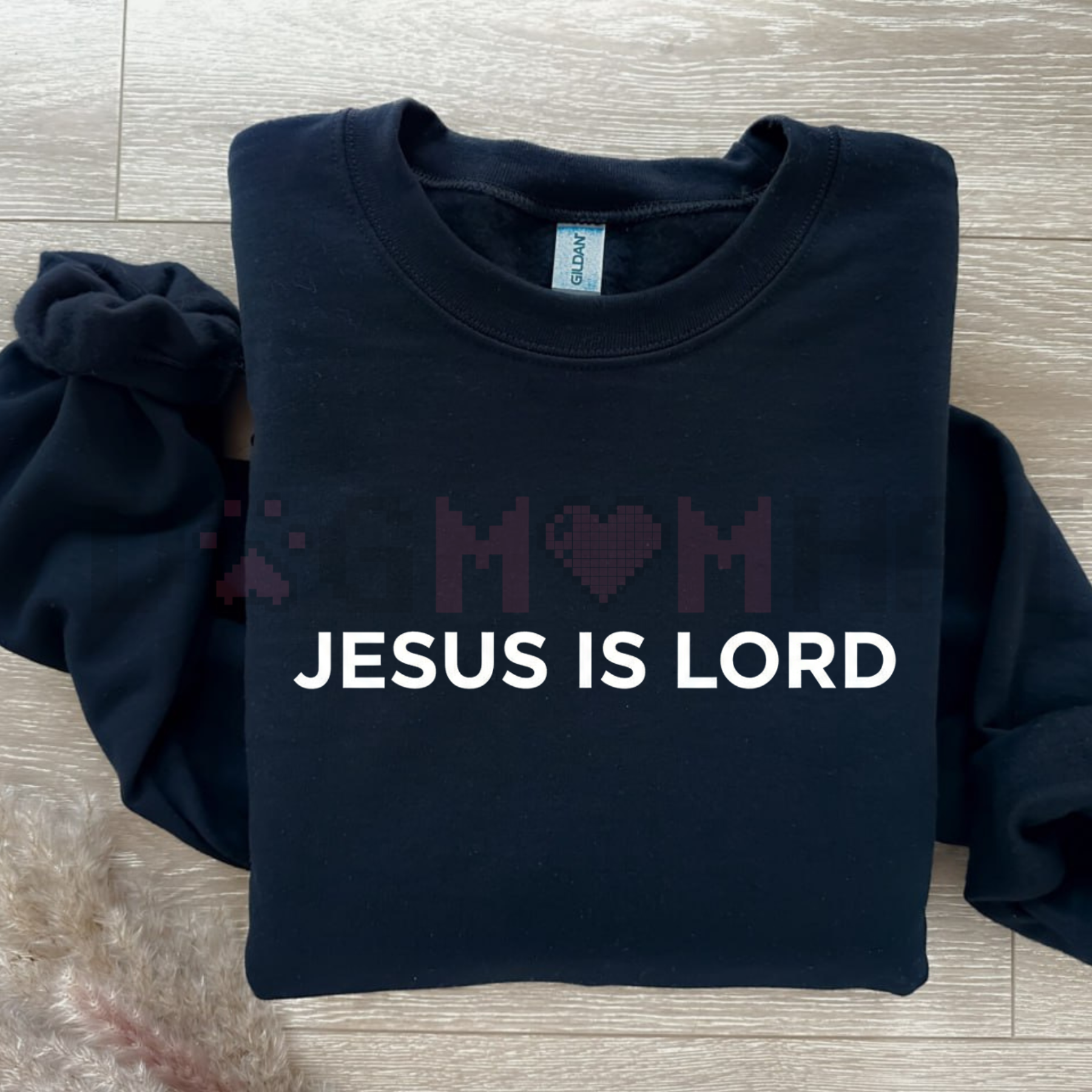 Navy sweatshirt with 'JESUS IS LORD' lettering across chest, crew neck and long sleeves