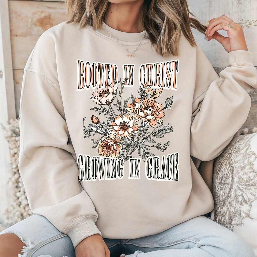 Cream long-sleeve crewneck T-shirt with floral 'Rooted in Christ' front graphic