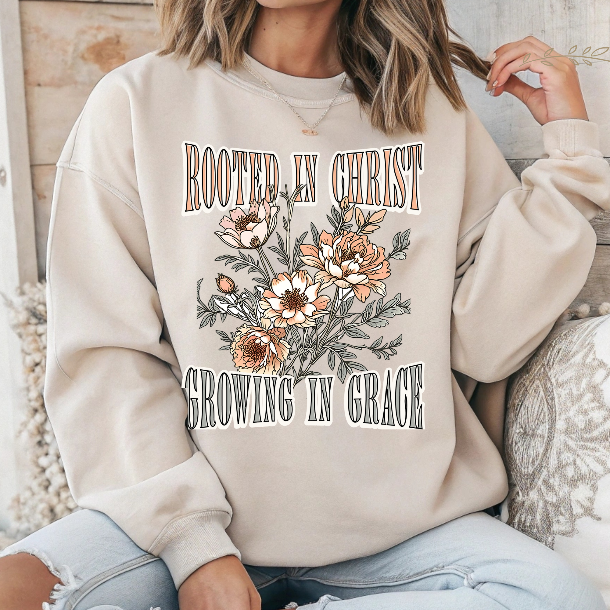 Cream long-sleeve crewneck T-shirt with floral 'Rooted in Christ' front graphic