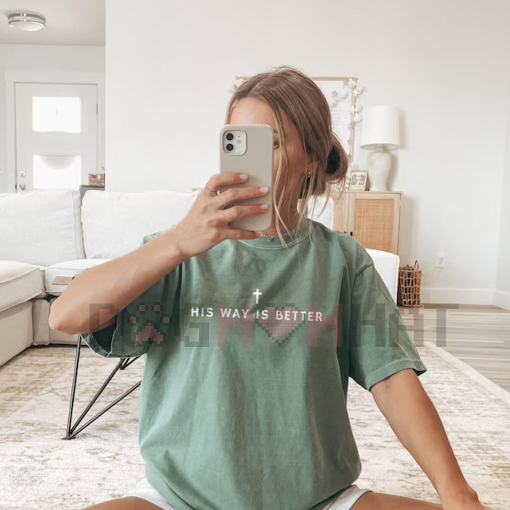 Seafoam green crewneck T-shirt with short sleeves and centered text with cross graphic
