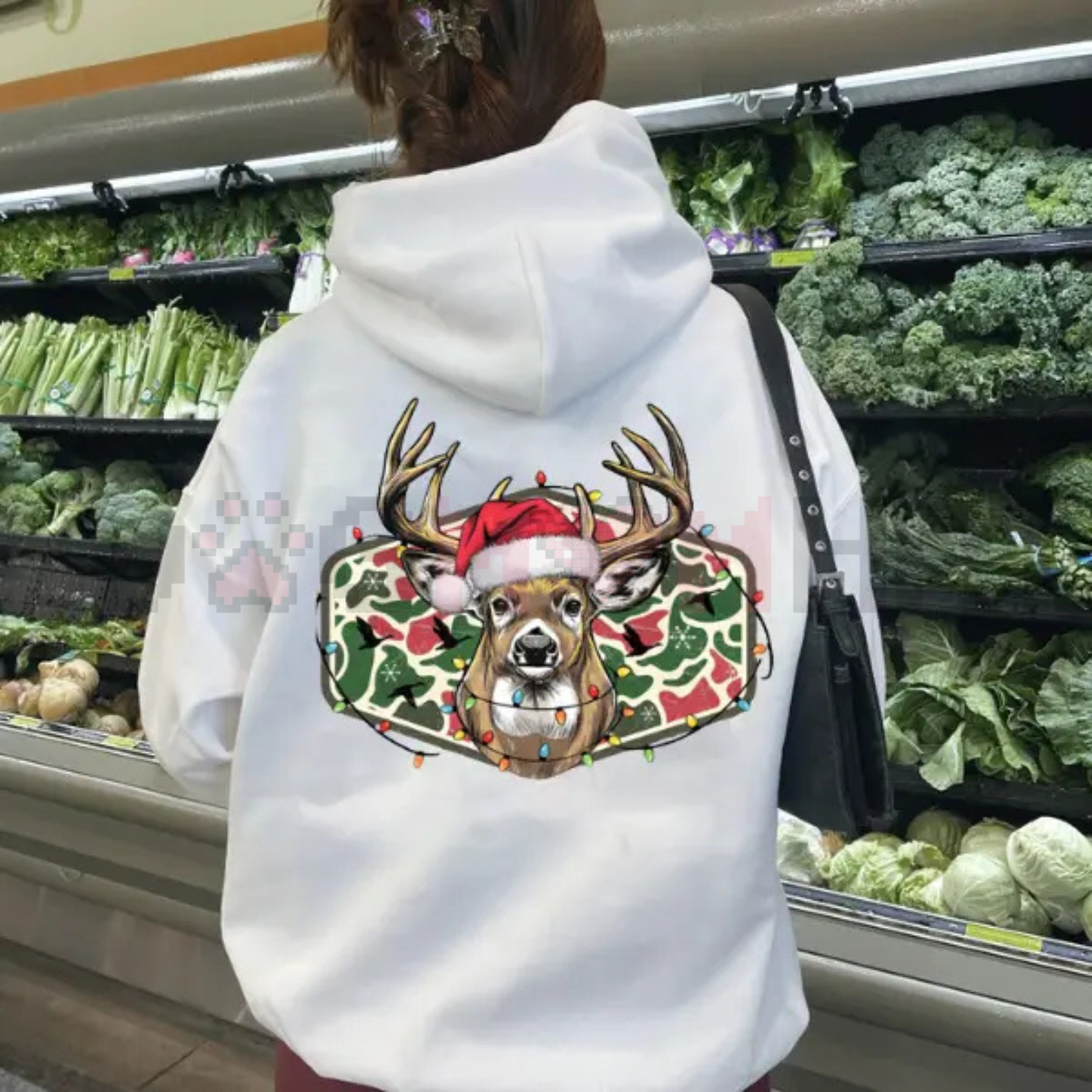 White hoodie back view with Christmas deer camo graphic centered under the hood.