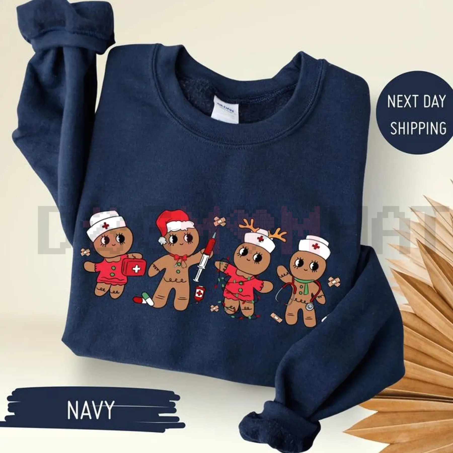 Navy sweatshirt with cartoon gingerbread nurse characters graphic on front, long sleeves