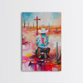 Framed canvas print of kneeling cowboy with hat, multicolor abstract desert scene