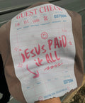 Brown guest check graphic tee with red lettering and 'Jesus paid it all' design