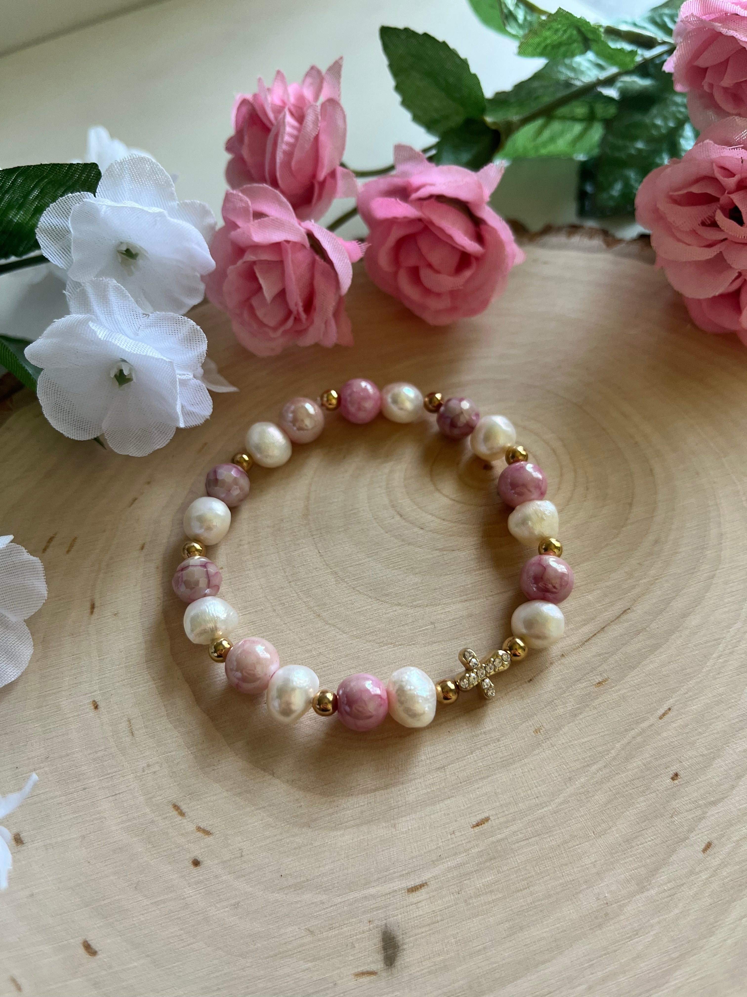 Pink and white pearl bead bracelet with gold cross charm and spacer beads