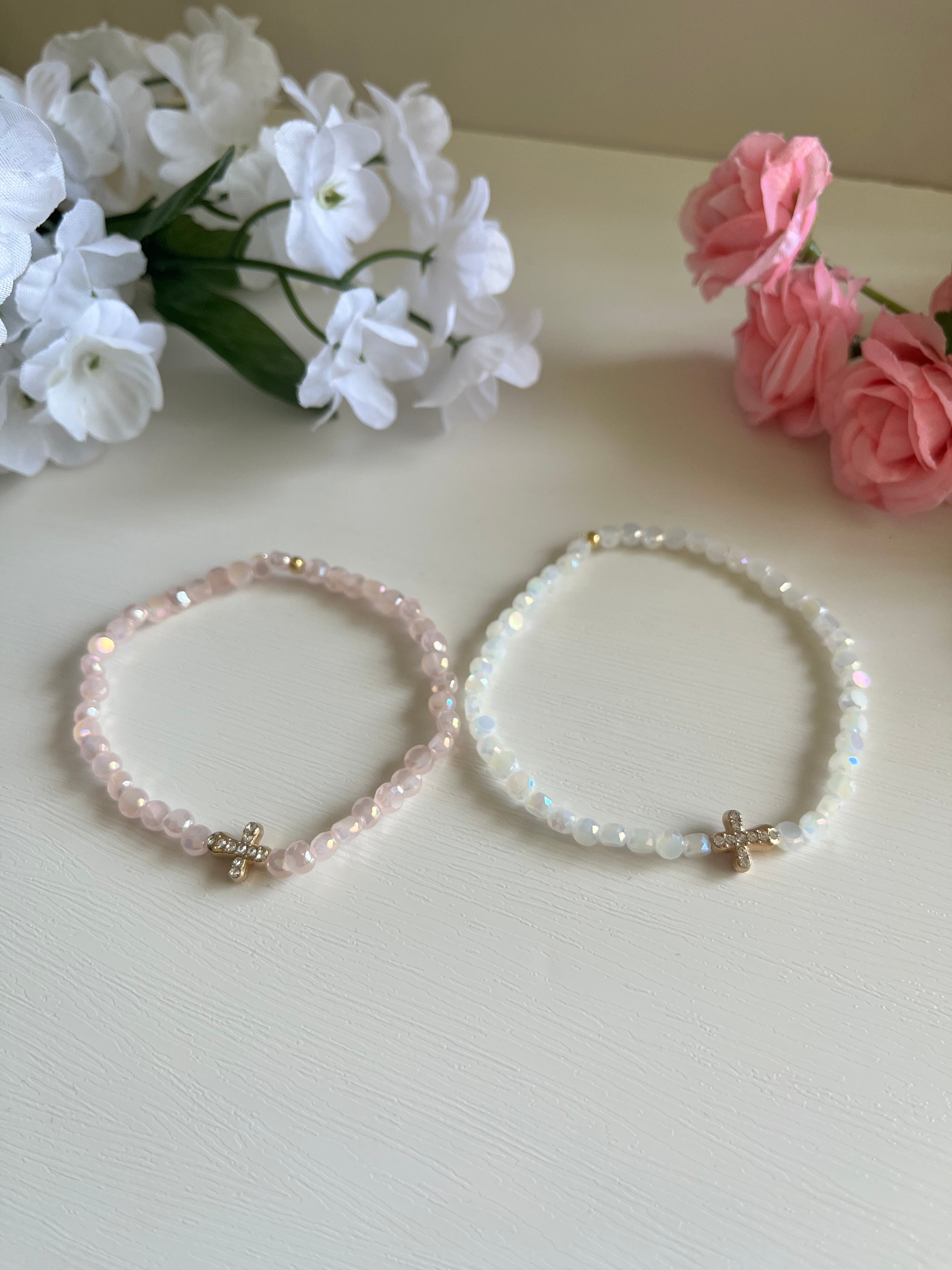 Pink and white beaded cross bracelets with gold cross charms