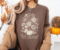 Dark brown graphic tee with floral tree design and text 'God is good ALL THE TIME'