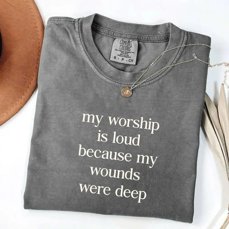 Dark gray short-sleeve V-neck T-shirt with light word graphic and gold necklace