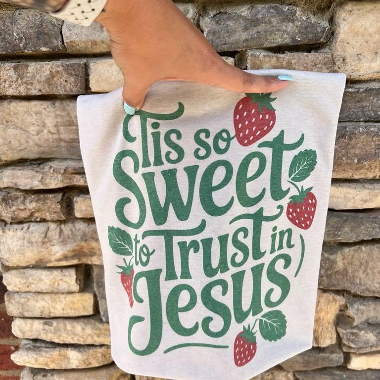 White Christian graphic T-shirt with strawberry design and 'Tis so sweet to trust in Jesus'