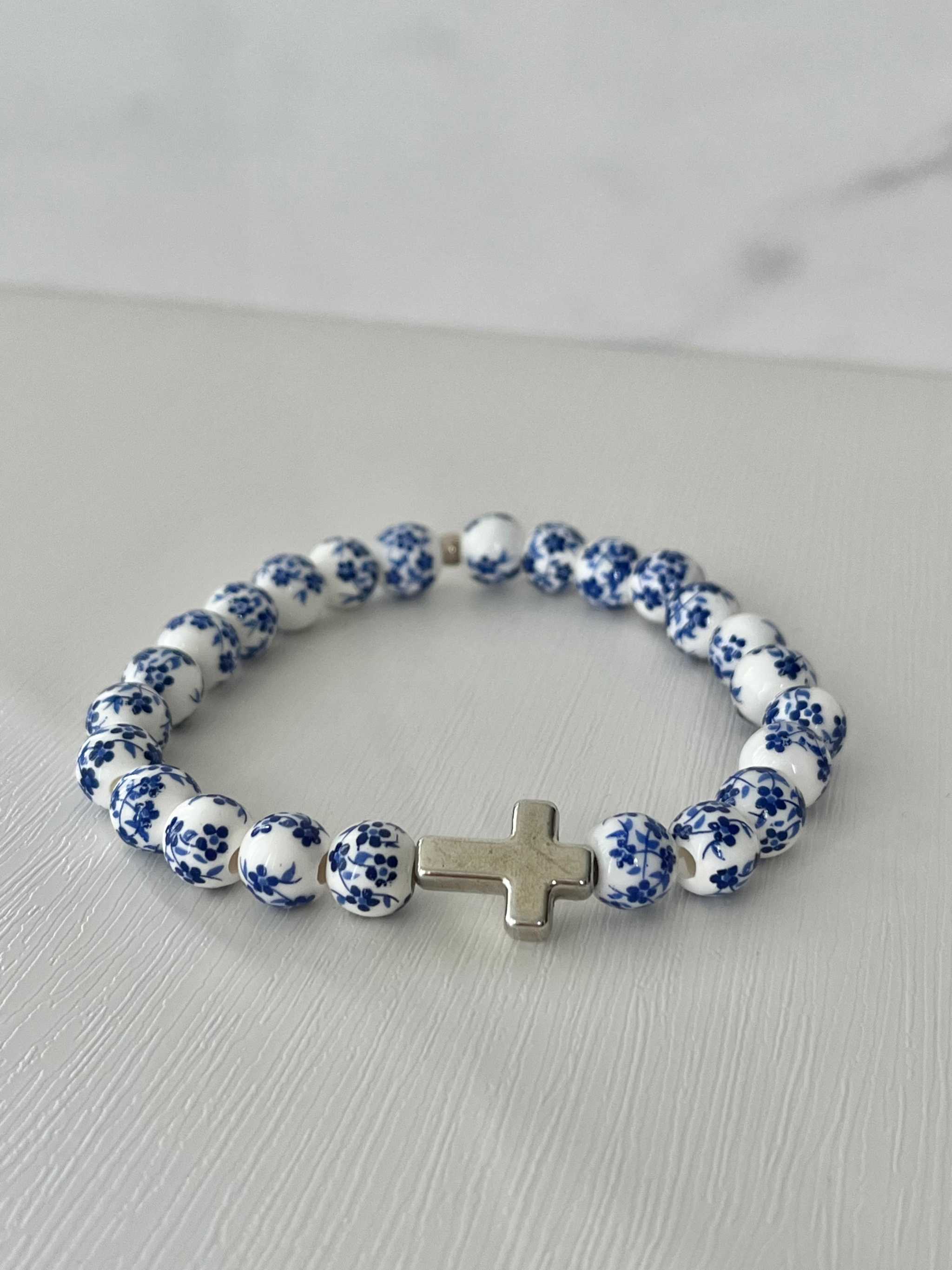 Blue and white beaded cross bracelet with silver cross charm