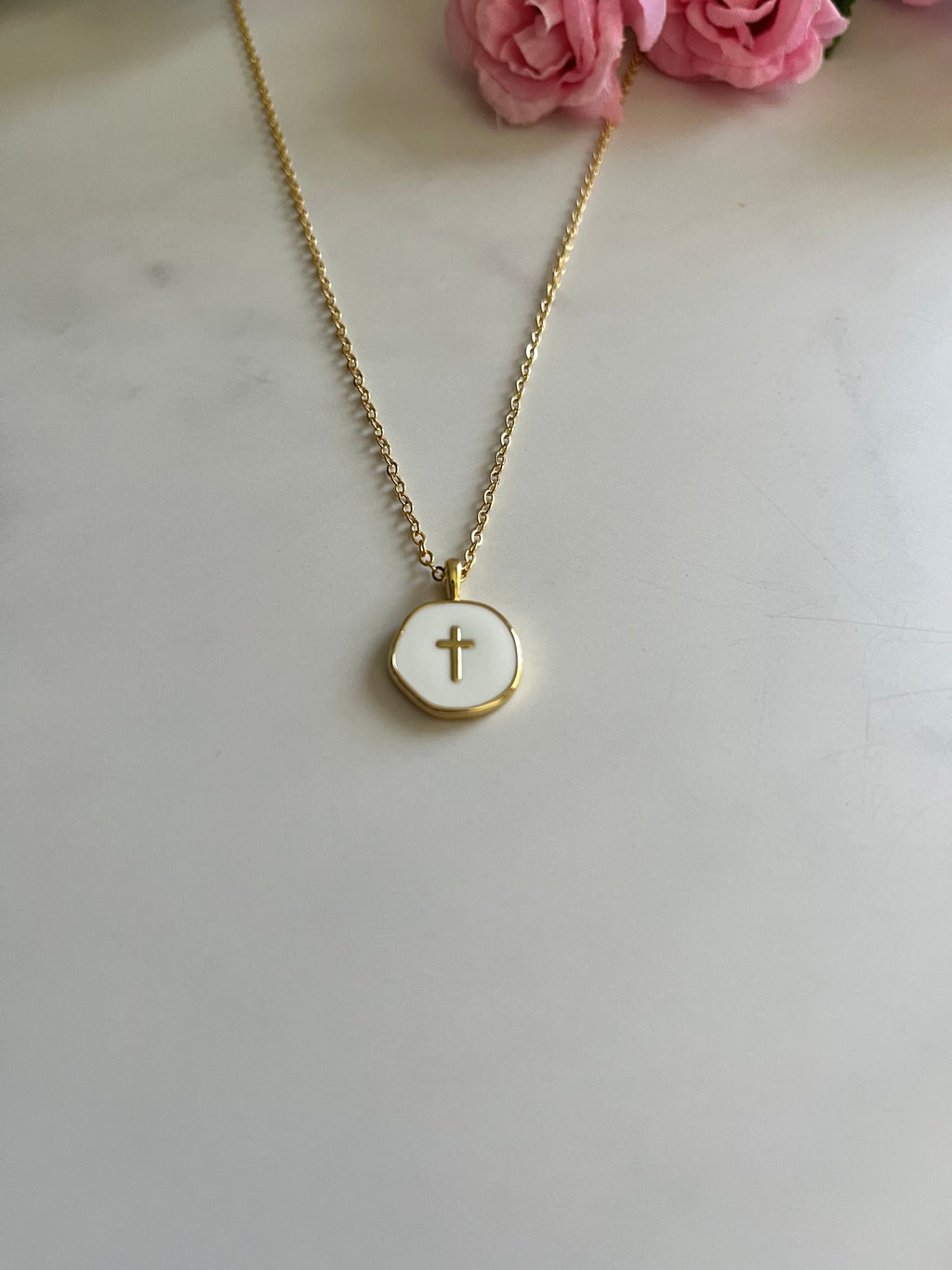 Gold cross pendant necklace with round pendant and slim chain