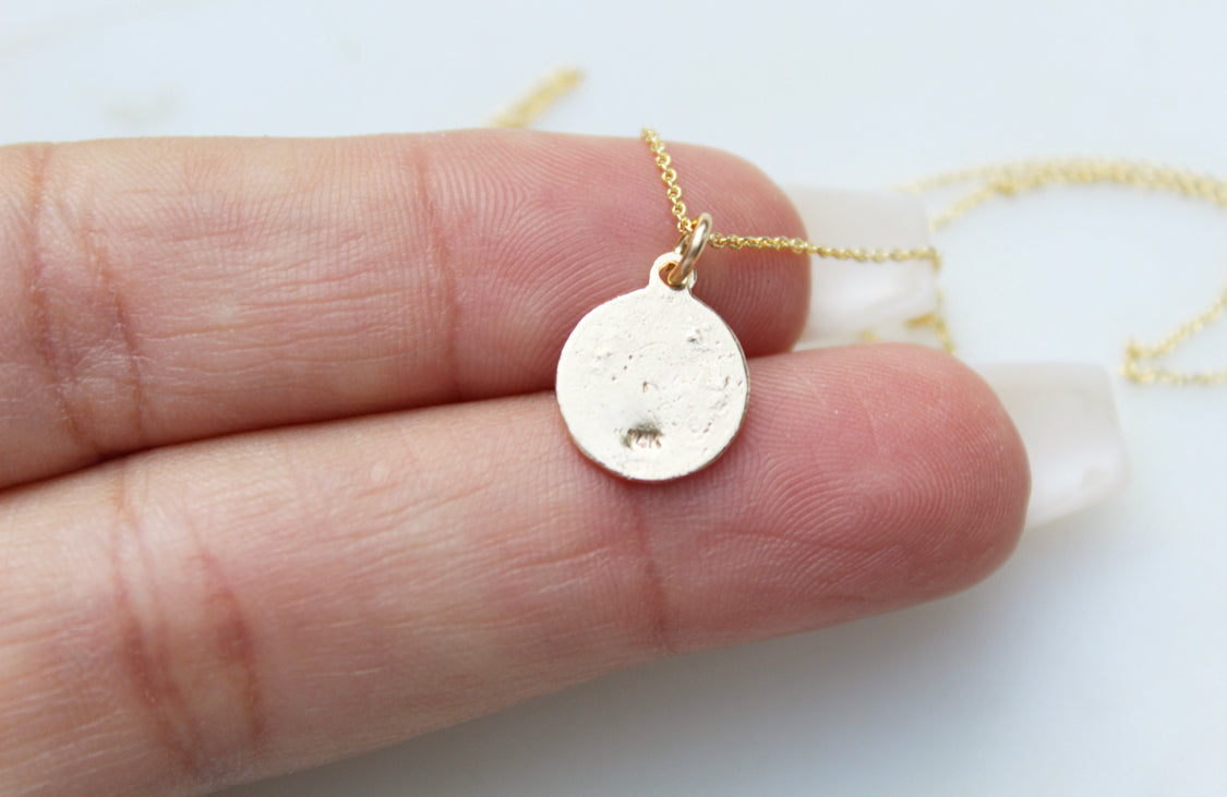 14k gold necklace with round disc pendant, simple back design on thin chain