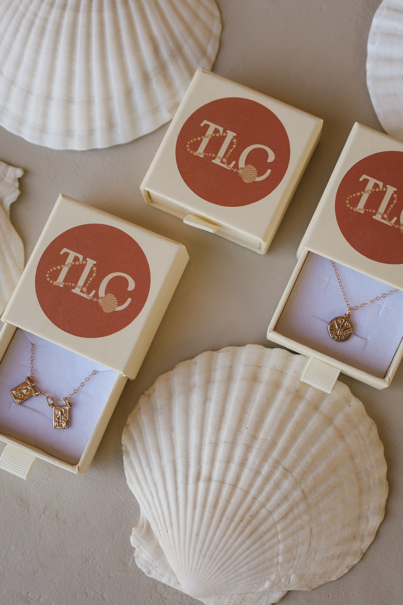 Boxed necklace set with gold Holy Spirit pendant and small cross charm