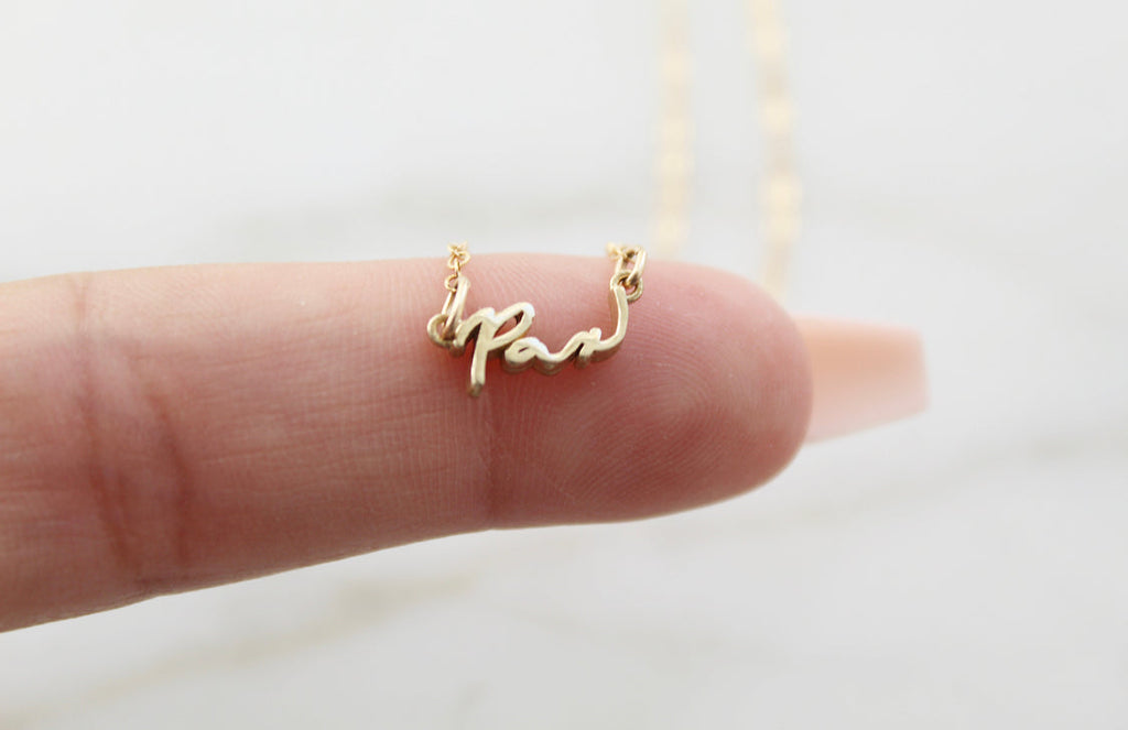 Pax necklace gold script pendant on short chain