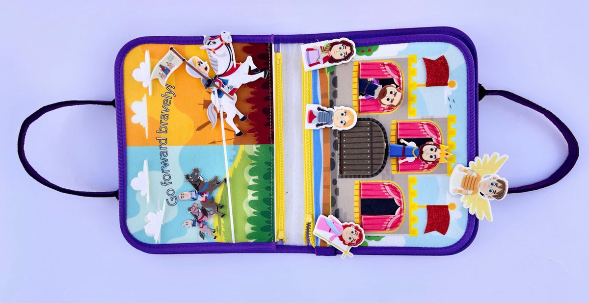 Busy book open page with playground buildings, characters, and colorful felt details