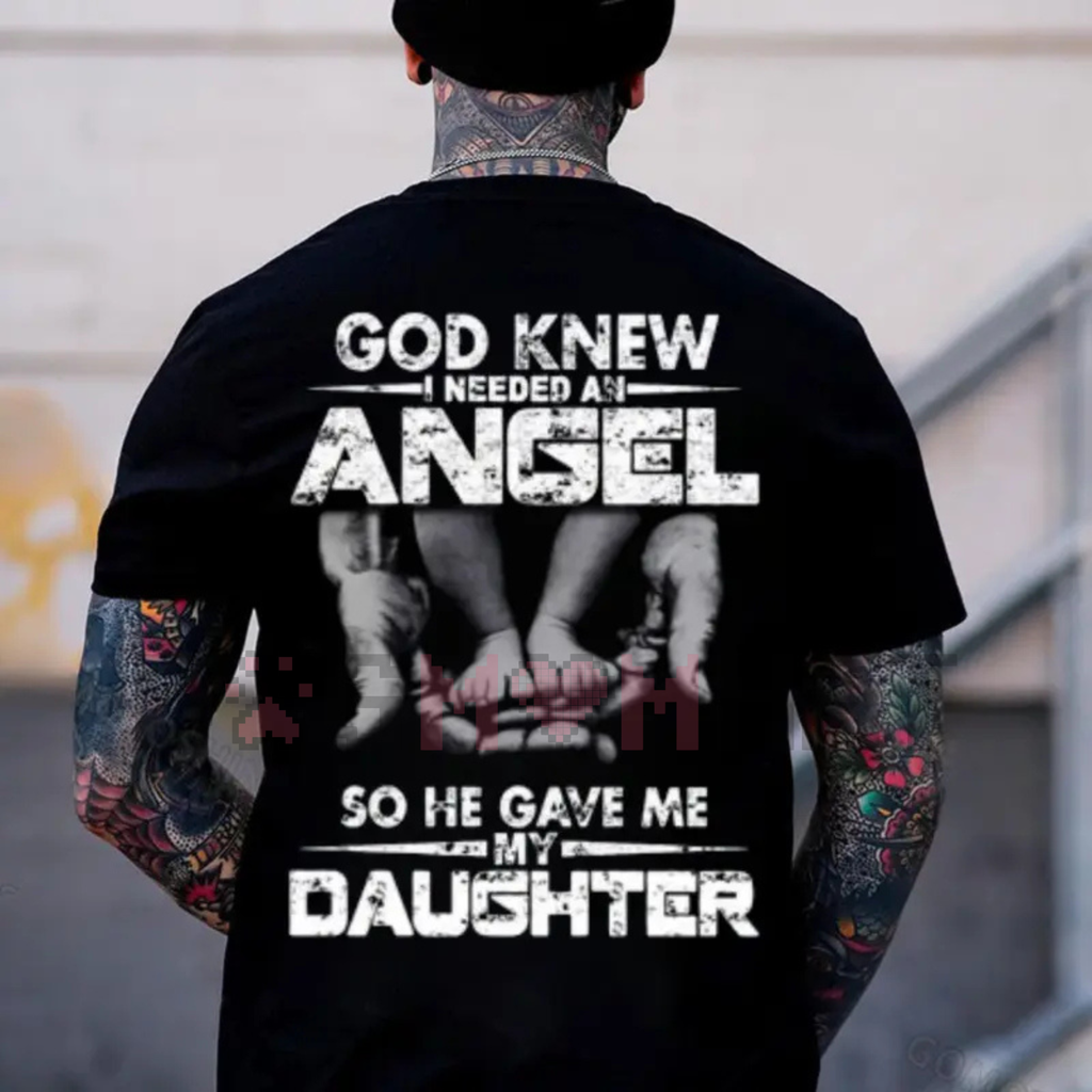 Black T-shirt with back graphic; tattoo-style sleeve art visible beneath