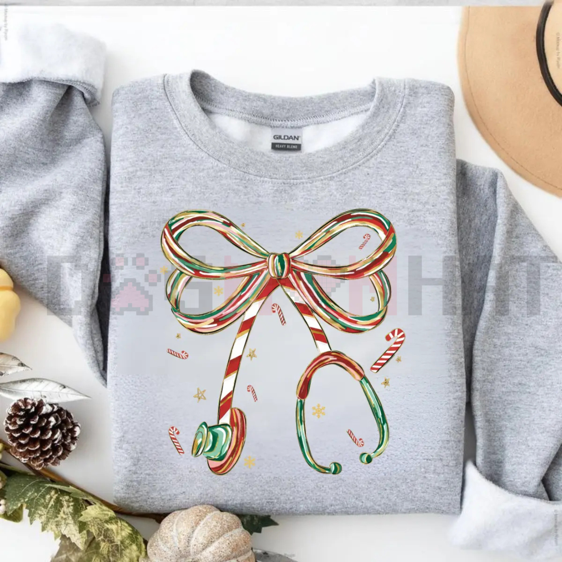Light gray Christmas nurse sweatshirt with colorful bow and candy cane graphic on front