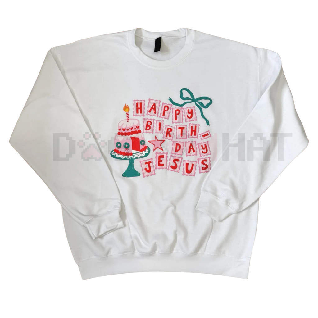 Folded white unisex crewneck sweatshirt with 'Happy Birthday Jesus' graphic