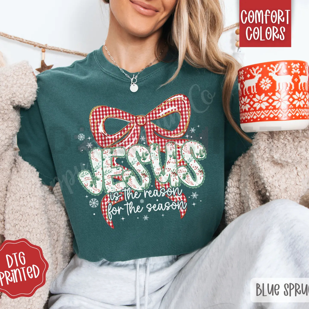 Teal crewneck tee with red plaid bow and festive lettering graphic