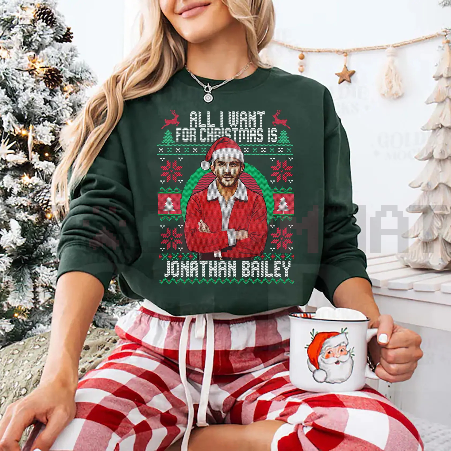 Dark green crewneck sweatshirt with holiday portrait graphic and text on front.
