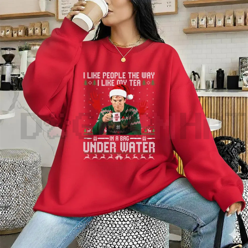 Red crewneck sweatshirt with Under Water graphic and holiday face print