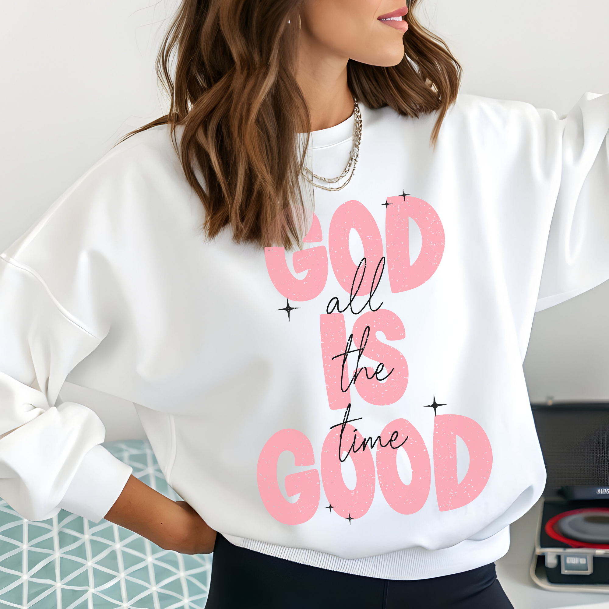 White crewneck sweatshirt with pink 'God all the time God' graphic and stars