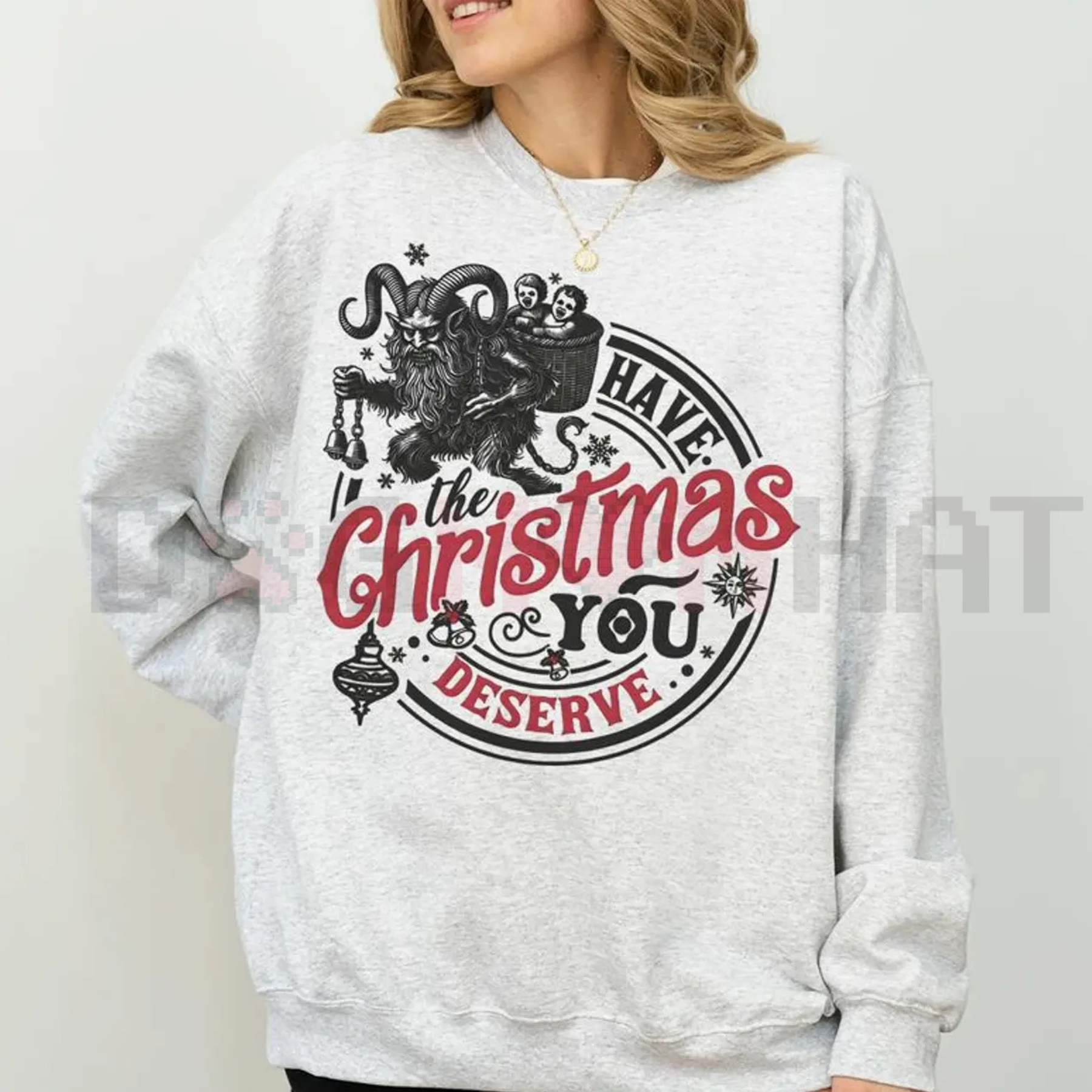 Light gray sweatshirt with gothic back graphic: “Have the Christmas you deserve”.